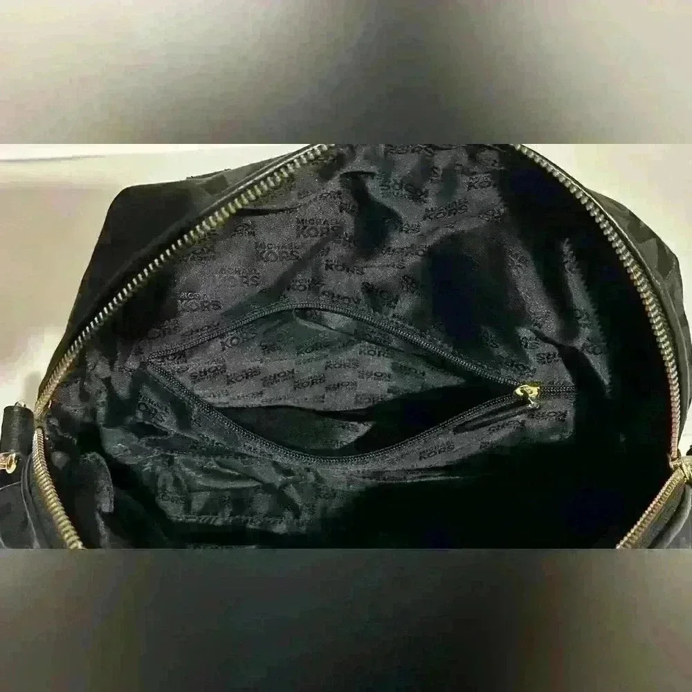 A Mickael Kors black Gladstone satchel with gold tone hardware. - Picture 8 of 14